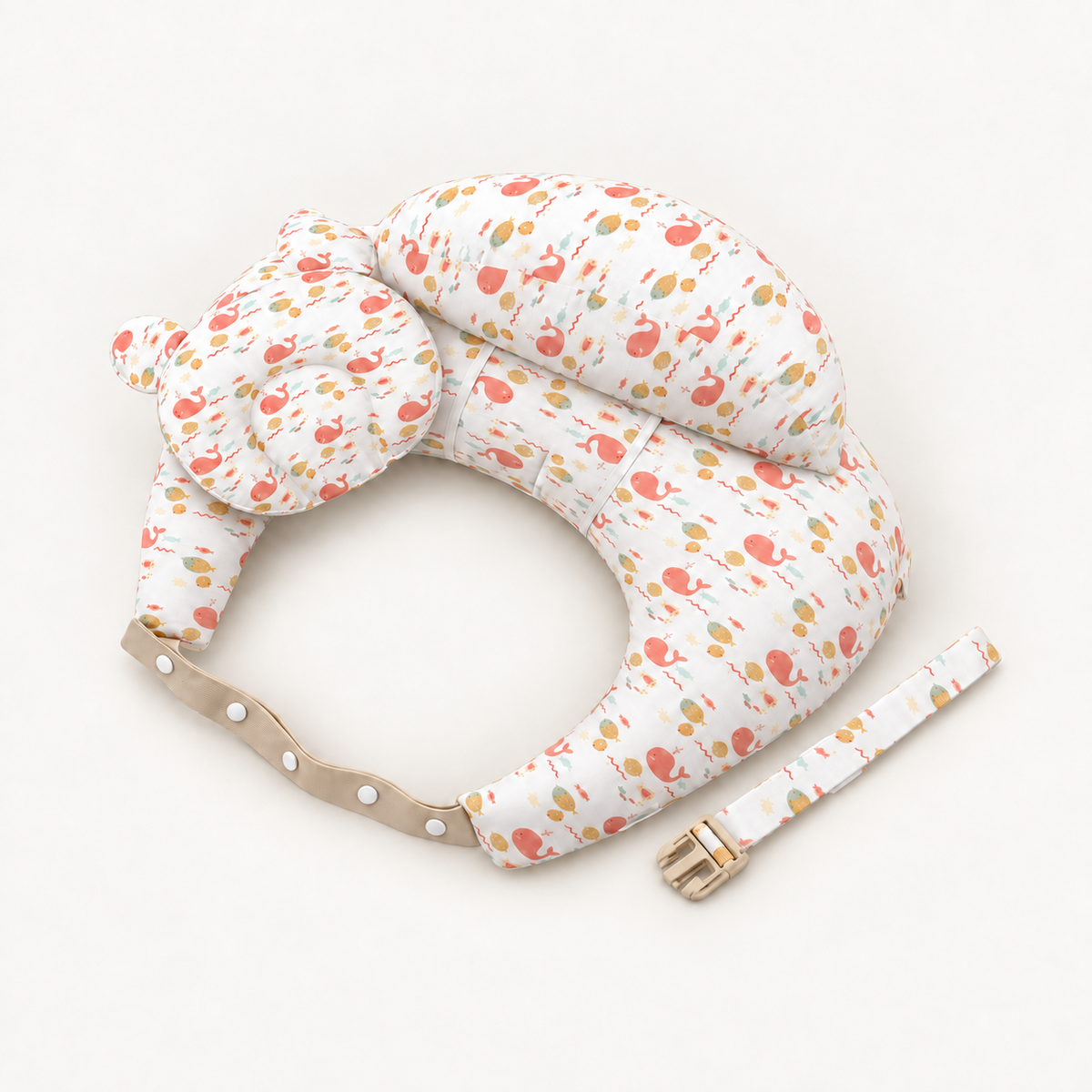 Peach Whale nursing support pillow with matching cushions and adjustable straps on a warm white background